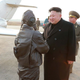 Illustration for article titled Kim Jong Un Visits Female Fighter Pilots, Picks Up Camera For Photo Op